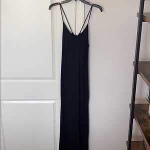 Full length slim fitting black dress